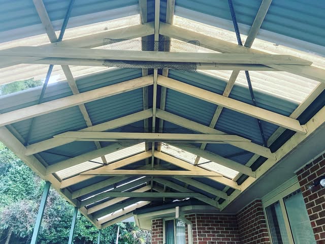 Timber framing and corrugated sheets on a roof extension